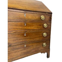 George III mahogany bureau, the fall-front banded and with boxwood stringing, enclosing fitted interior with pigeonholes and drawers surrounding a central cupboard with inlaid shell motif, the base with four graduating cock-beaded drawers, each with pressed brass handle plates with central lion masks and ivory escutcheons, on shaped bracket feet
This item has been registered for sale under Section 10 of the APHA Ivory Act
