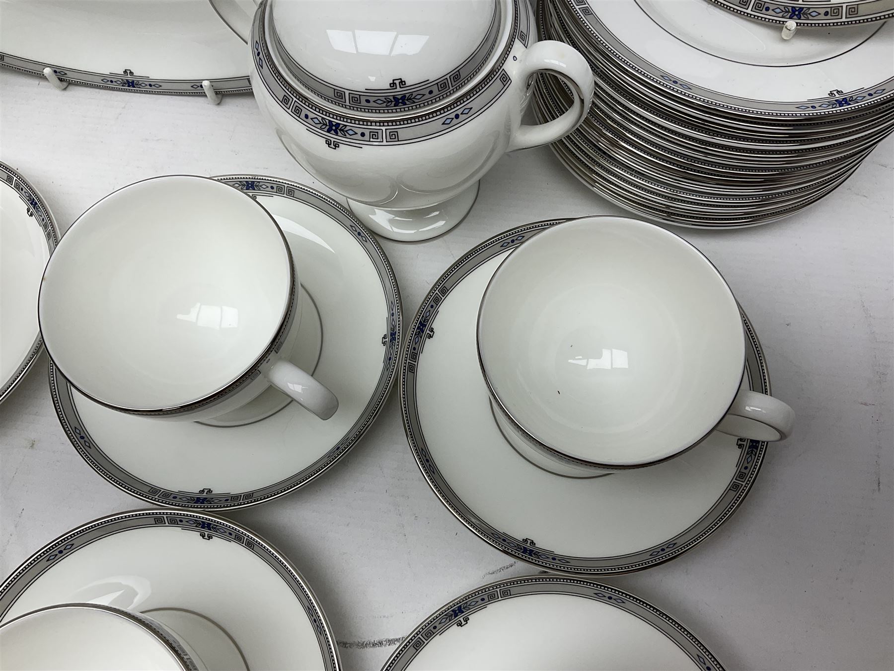 Wedgwood Amherst pattern part tea service, comprising eight cups and saucer, sixteen dessert plates, milk jug, covered sucrier, together with matching platter and two open serving dishes