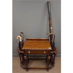  Early 20th century rectangular oak hall-stand with sticks and single snooker cue, one drawer with brass handles, four turned supports and stretchers, W93cm, H83cm, D34cm  