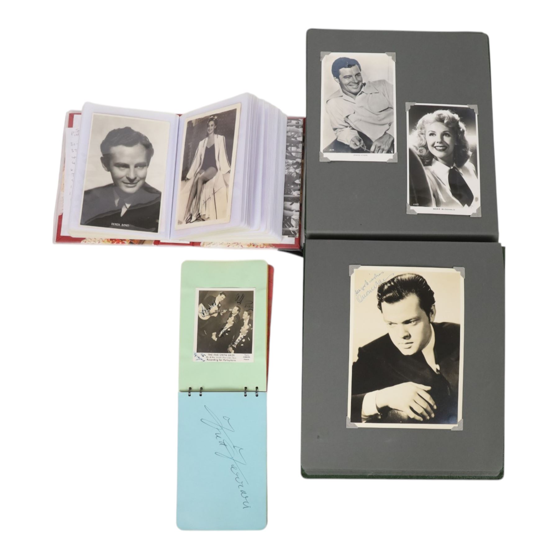 Collection of photographs and postcards, mostly depicting 1940s film stars, including some autographed examples and some with printed signatures, together with a collection of Shirley Temple  promotional photographs,1930s autograph album and postcards of the Royal Family