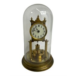 Gustav Becker - German Urania torsion clock with a glass dome, late 19th century 400-day movement with an enamel dial, arabic numerals and steel spade hands, movement supported by two brass pillars on a circular base, adjustable rotating pendulum with torsion suspension intact. With Key.