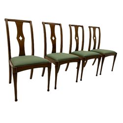 Set of eight contemporary walnut dining chairs, curved backs set with shaped splats with pierced detail, drop in upholstered seat cushions, on turned supports 
