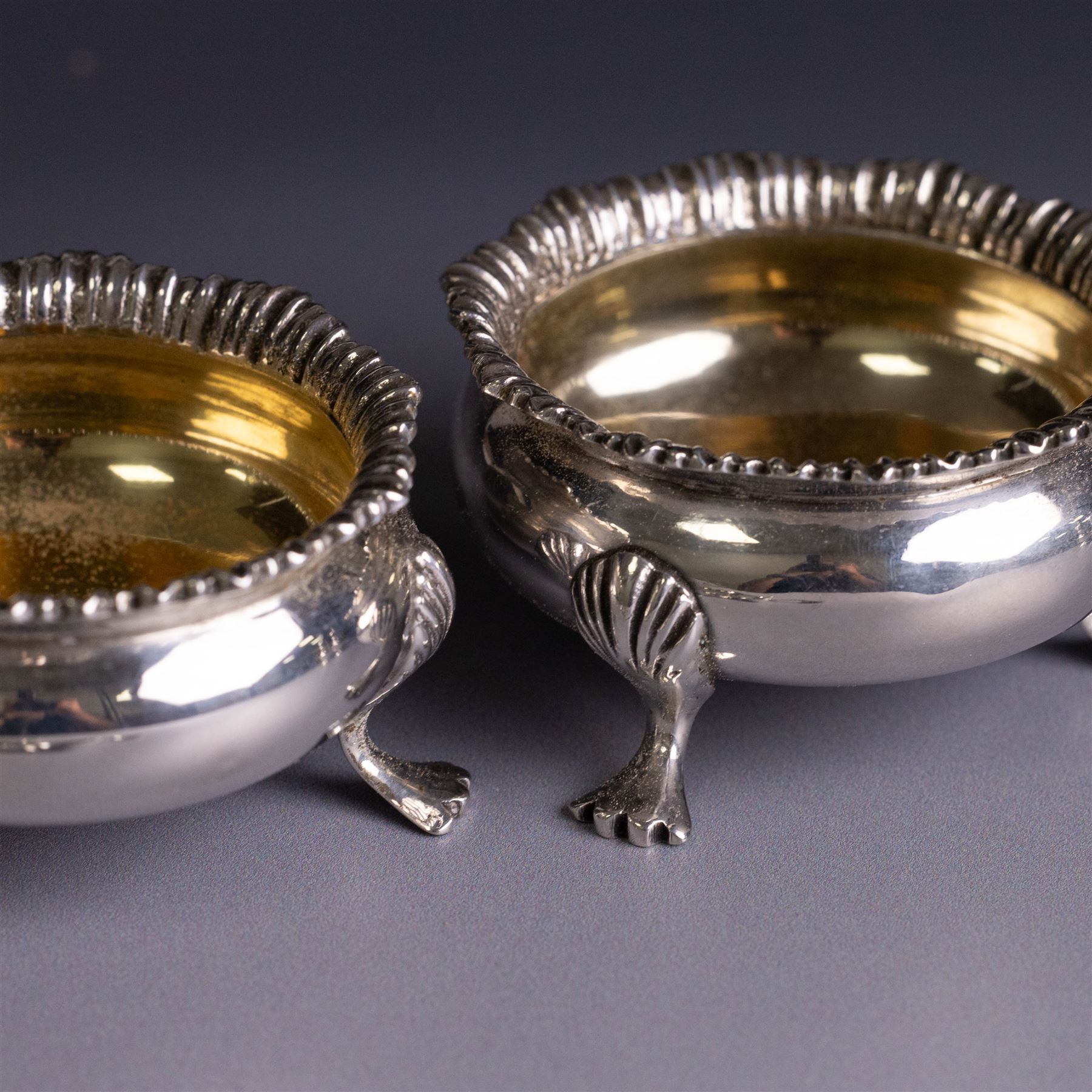 Silver cruets, including pair of open salts, mustard pot and cover, two silver pepper shakers and a collection of spoons, all hallmarked