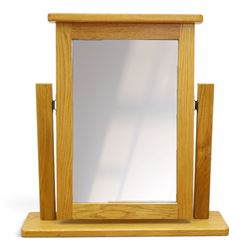 Contemporary oak kneehole dressing table and mirror, rectangular shaped top fitted with two drawers, on square tapering supports