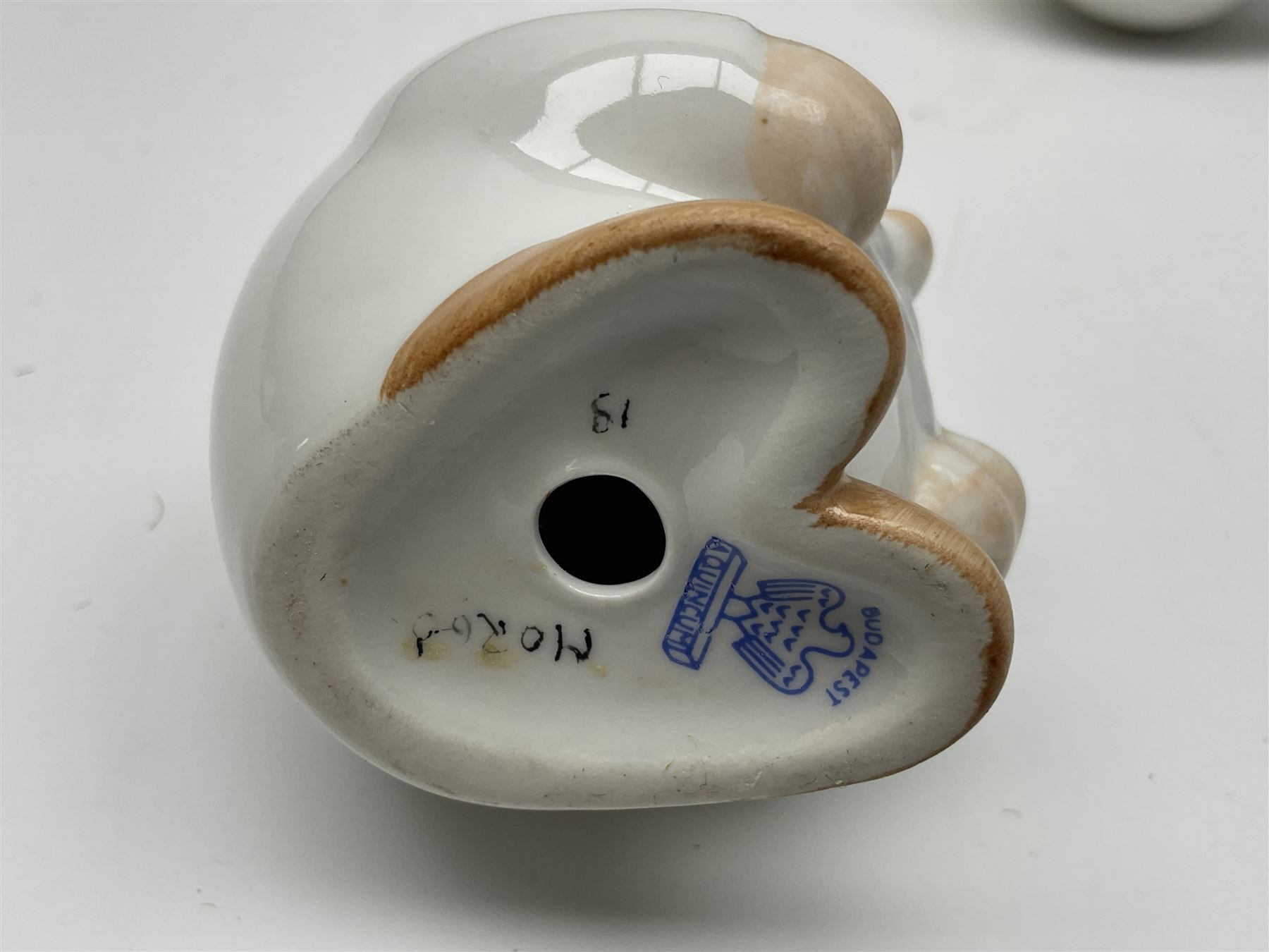 Group of eleven Aquincum of Budapest figures, comprising two of a man in a feather hat, seven dwarves, man and woman in traditional dress, all with printed marks beneath