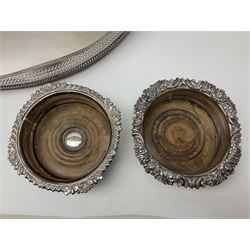 Pair of Mappin and Webb silver plate pierced pedestal bon bon dishes, together with other silver plate comprising teapot stand engraved with lion's head to centre, two cut glass claret jugs, two bottle coasters with acorn decoration, two open salts upon dolphin mounts, tea caddy, three piece cruet set and a large oval tray with pierced sides and upon four ball feet