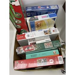 Quantity of jigsaw puzzles, mostly in original packaging, together with a puzzle and roll jigsaw board and six table lamps with fabric shades, in two boxes
