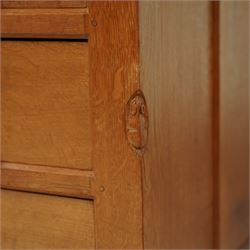 Mouseman - oak pedestal kneehole desk, adzed rectangular top over twin pedestals each fitted with three drawers, arched kneehole with panelled interior, on plinth base, signature carved mouse to side, by the workshop of Robert Thompson, Kilburn