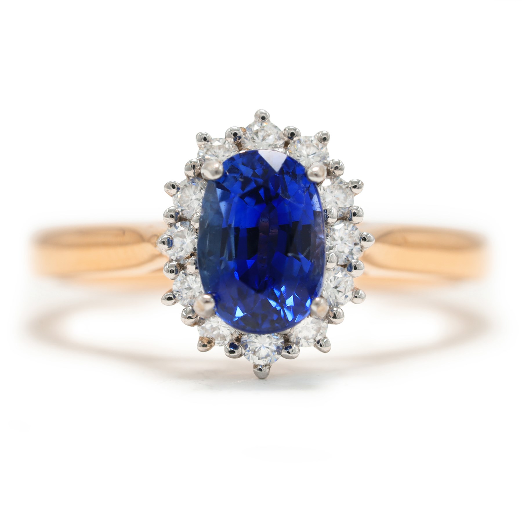 18ct rose gold sapphire and diamond cluster ring, single oval cut sapphire of approx 1.25 carat, with round brilliant cut diamond surround, hallmarked, total diamond weight approx 0.25 carat