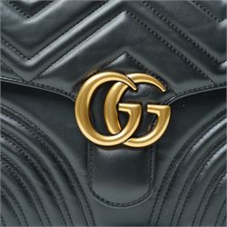 Gucci GG Marmont black matelassé leather top handle bag, made in Italy, with chevron quilted leather and heart motif to the reverse, antique gold-tone Double G front hardware, leather top handle and detachable chain shoulder strap with leather shoulder guard, front flap closure, suede-effect interior with zip pocket and leather logo tab stamped Gucci made in Italy, together with original Gucci dust bag and carrier, W27cm D11cm H20cm