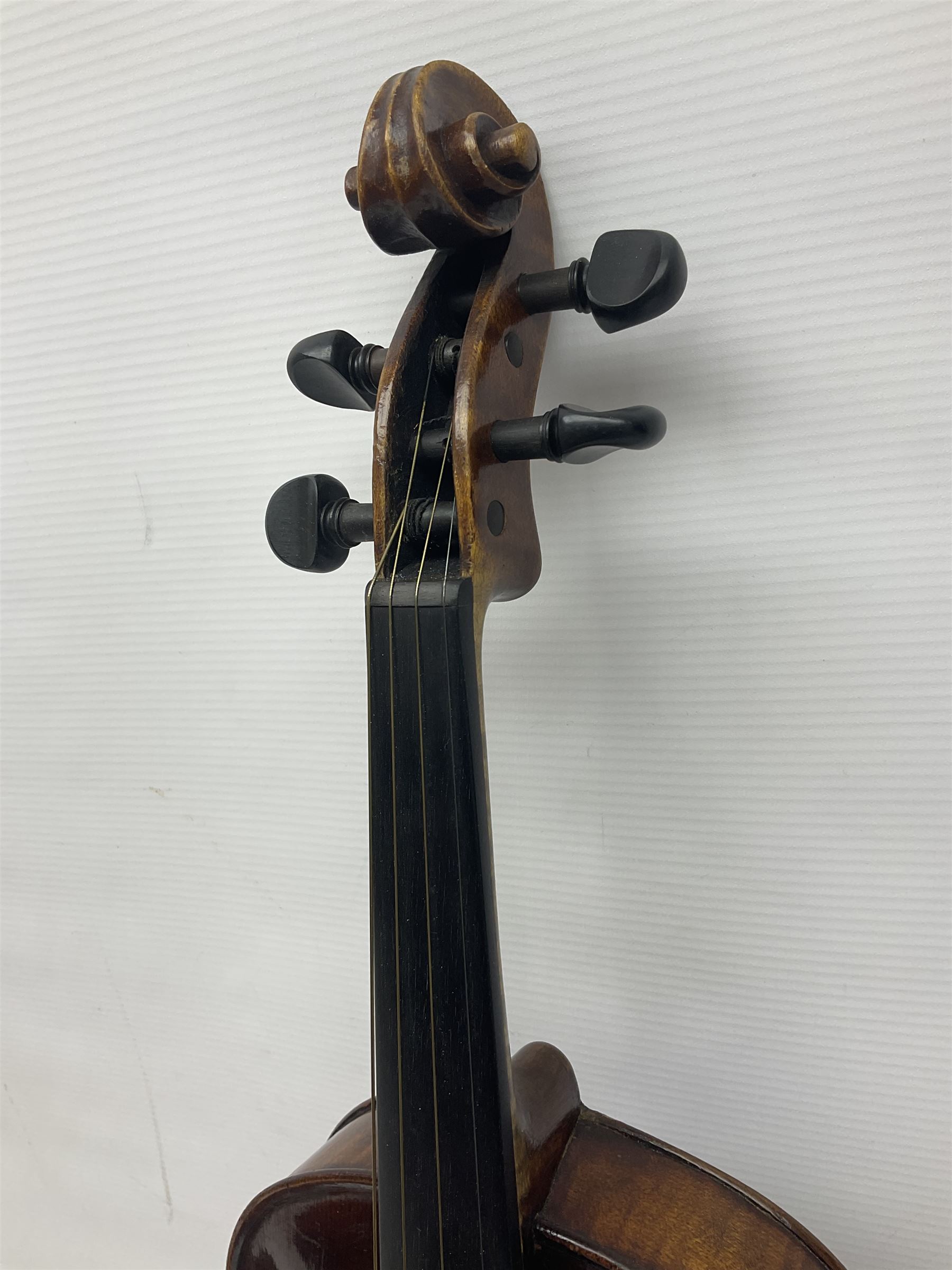 German trade violin in the Steiner style c1900 with 35.5cm two-piece maple back and ribs and spruce top L59cm overall; in fitted carrying case with two bows; and a Saxony violin with 35.5cm one-piece maple back and ribs and spruce top L58.5cm overall (2)