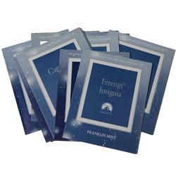 Franklin Mint The Official Star Trek Insignia Collection, set of twelve sterling silver insignia with gold plated decoration, all stamped 925 sterling with certificates of authenticity, contained within a wooden glazed display case, case H56cm