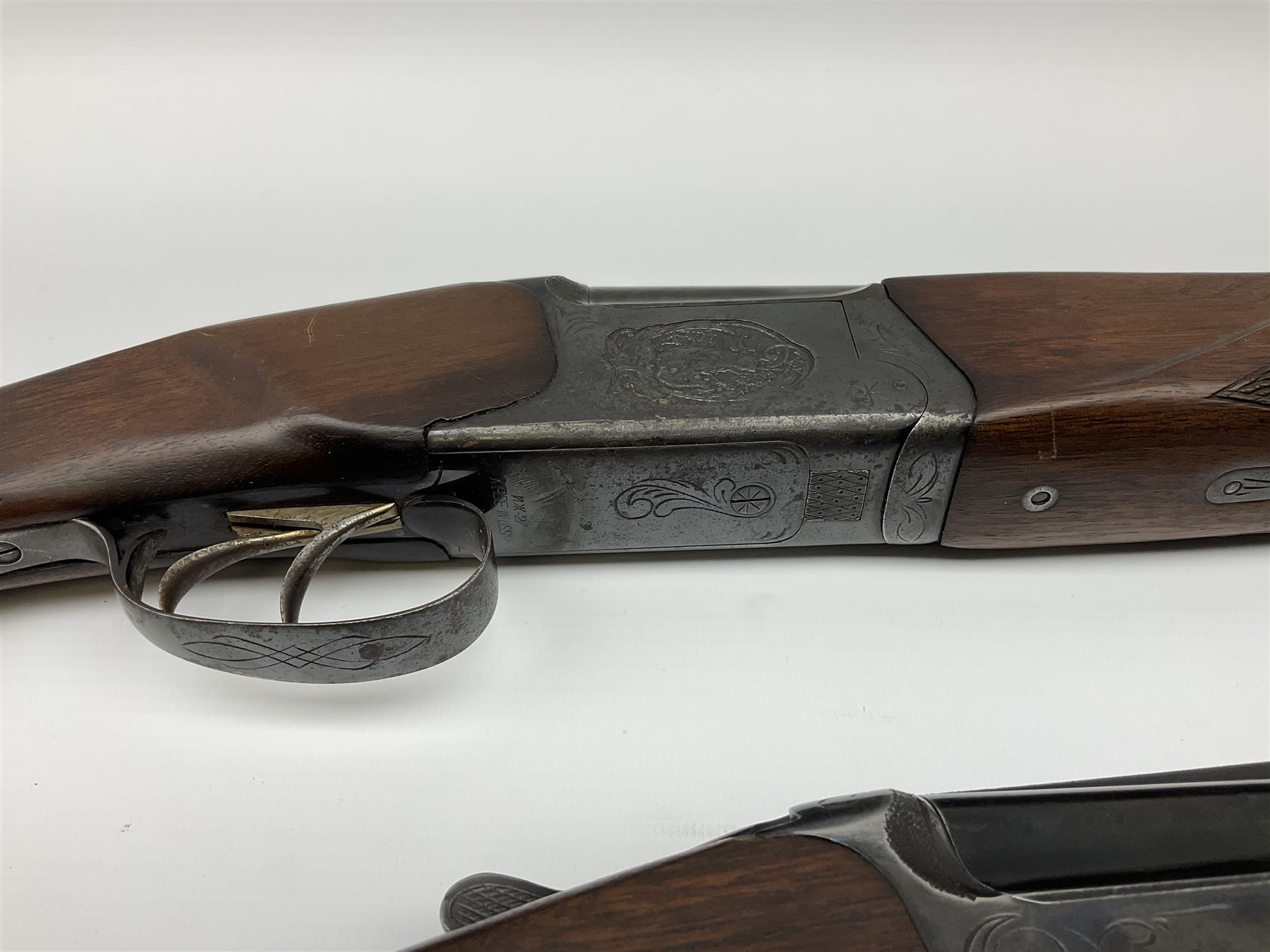 Two Russian Baikal 12-bore over-and-under double barrel boxlock non-ejector sporting guns; one with 68.5cm barrels, walnut stock with chequered pistol grip and fore-end and thumb safety, serial no.520545, L111cm overall; the other with 72.5cm barrels, walnut stock with chequered pistol grip and fore-end and thumb safety, serial no.012448, L114.5cm overall (2) SHOTGUN CERTIFICATE REQUIRED