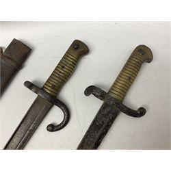French Model 1874 Epee bayonet marked Oulle 1876 in associated scabbard; Model 1866 sabre bayonet in cut-down sword scabbard; and Model 1842/59 sabre bayonet in relic condition (3)
