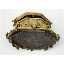 Late 19th century gilt bronze casket, of lozenge form with cast and applied detail in the form of hounds' heads, dead game, and foliate vines, the hinged opening cover surmounted with the figure of a hunting dog, H10cm 