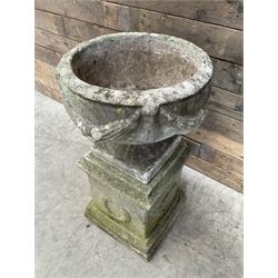 Cast stone centerpiece urn on plinth