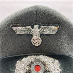 WW2 German Infantry Officer's visor cap with cloth insignia; labelled and stamped Offizier Kleiderkasse Berlin and Erel Stirnschutz