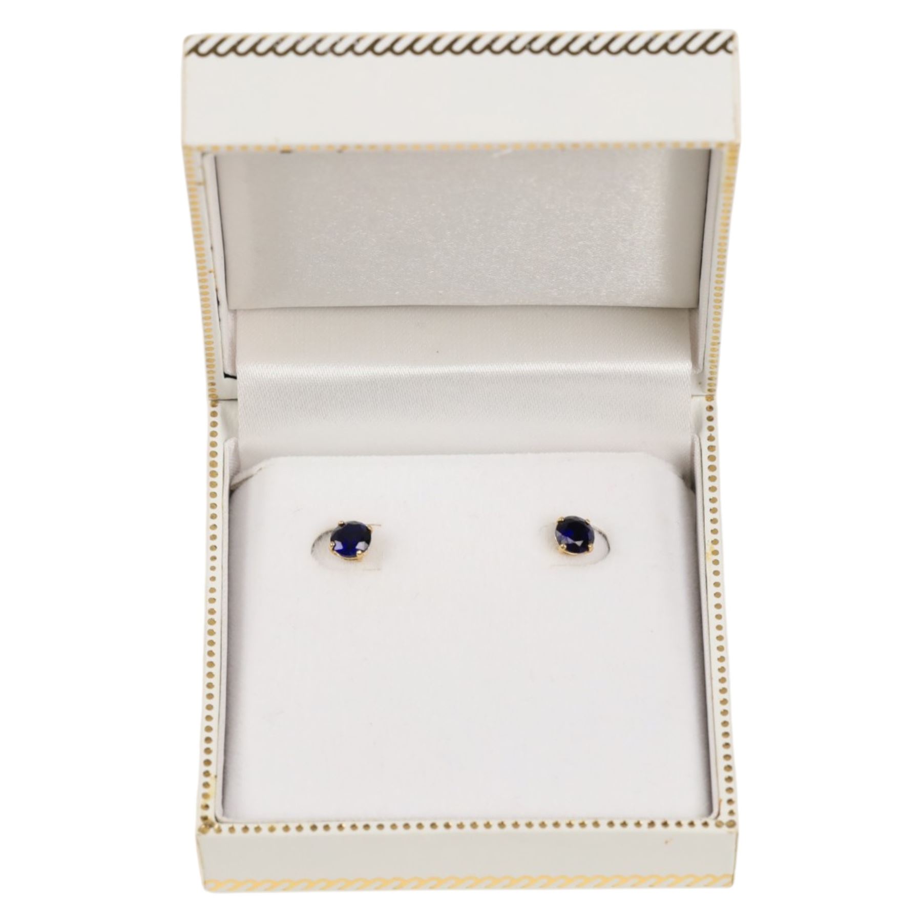 Pair of 9ct gold blue stone stud earrings, boxed