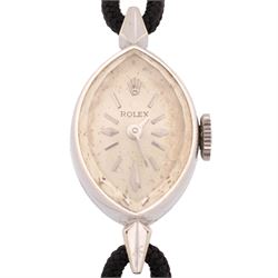 Rolex ladies 14ct white gold manual wind wristwatch, circa. 1960's, silvered dial with baton and diamond hour markers, marquise shaped case, stamped 14K, on black cord bracelet