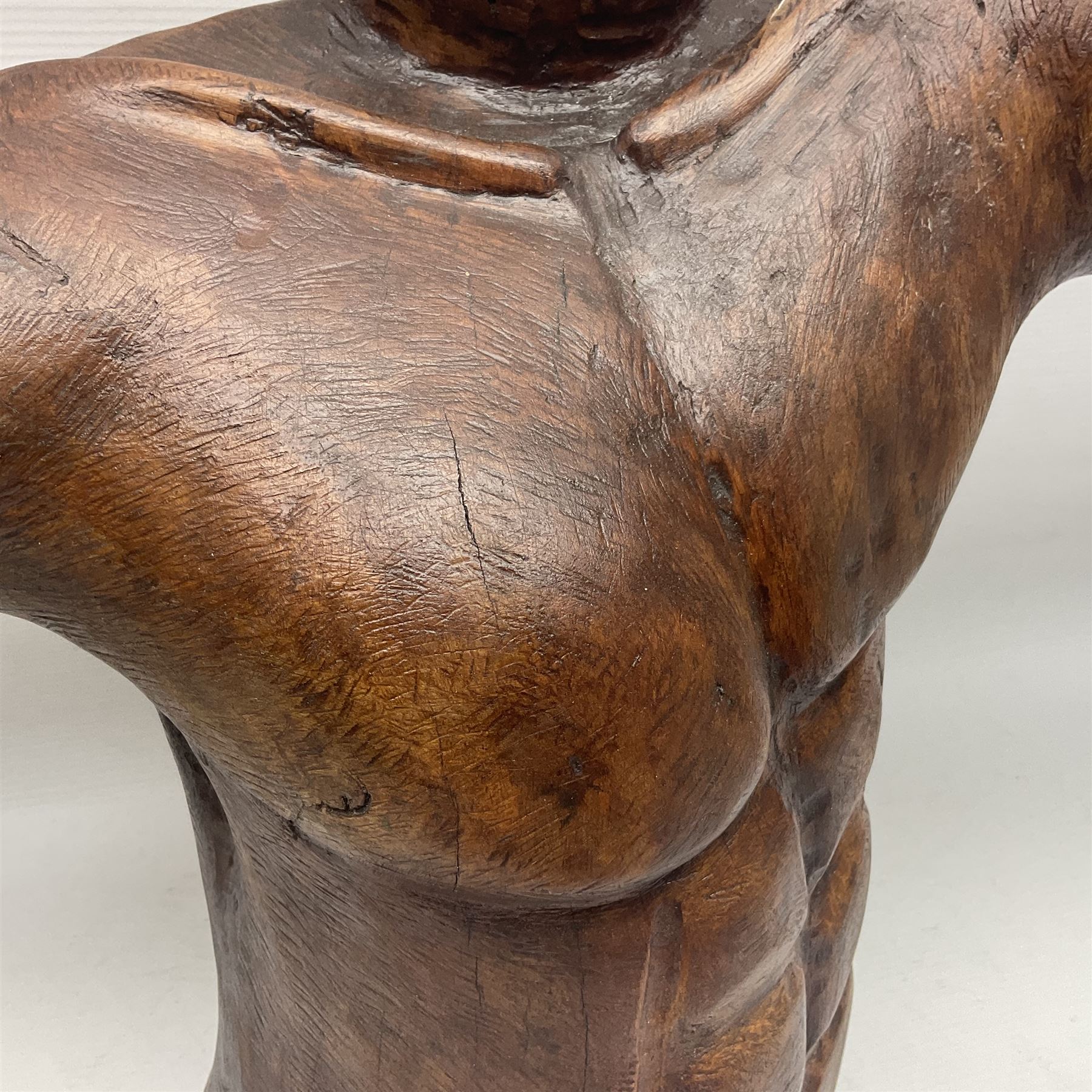 Helen Skelton (British 1933 – 2023): Large carved wooden sculpture, modelled as a male torso, H40cm. Born into an RAF family in 1933 in Kent and travelled the world extensively during her childhood. After settling in Bridlington, Helen immersed herself in painting, textiles, and wood sculpture, often inspired by nature's beauty. Her talent was showcased in a one-woman show at Sewerby Hall and recognised with the sculpture prize at Ferens Art Gallery in 2000. Sadly, Helen’s daughter passed away from cancer in 2005. This loss inspired Helen to donate her sculptures to Marie Curie upon her passing in 2023.