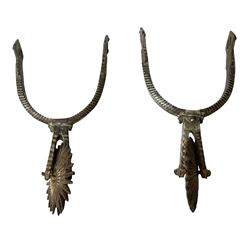Pair of late 19th century South American iron spurs, engraved silver mounts, with sunburst rowls