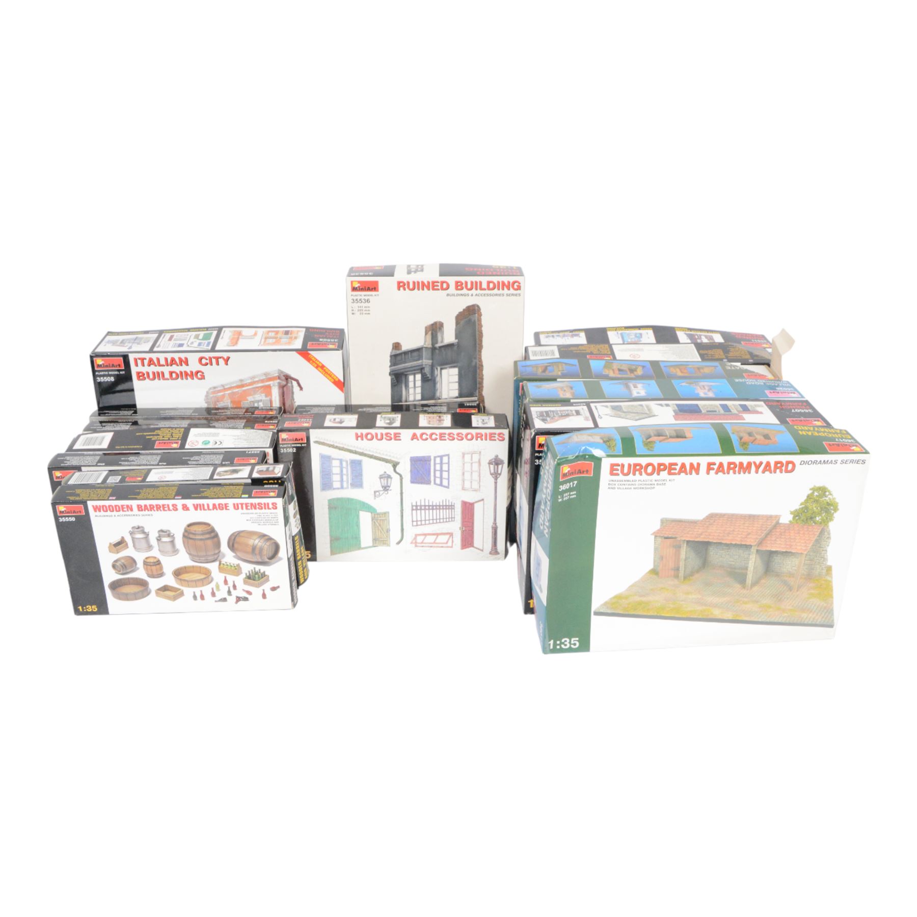 Seventeen Mini Art 1:35 scale model building and accessory kits, comprising 36017 European Farmyard, 35511 Ruined Garage, 35508 Italian City Building, 35536 Ruined Building, 35507 French Farmyard, 36020 Village Road with Ruined House, 36034 Farm Gate with Base, 35537 German Pharmacy Ruin, 35502 House Accessories, 35005 Building Accessories, 35583 Cable Spools, 35571 Wine Bottles and Crates, 35530 Street Accessories, 35578 Water Pump, 35581 Wooden Boxes and Crates and two 35550 Wooden Barrels and Village Utensils, all boxed