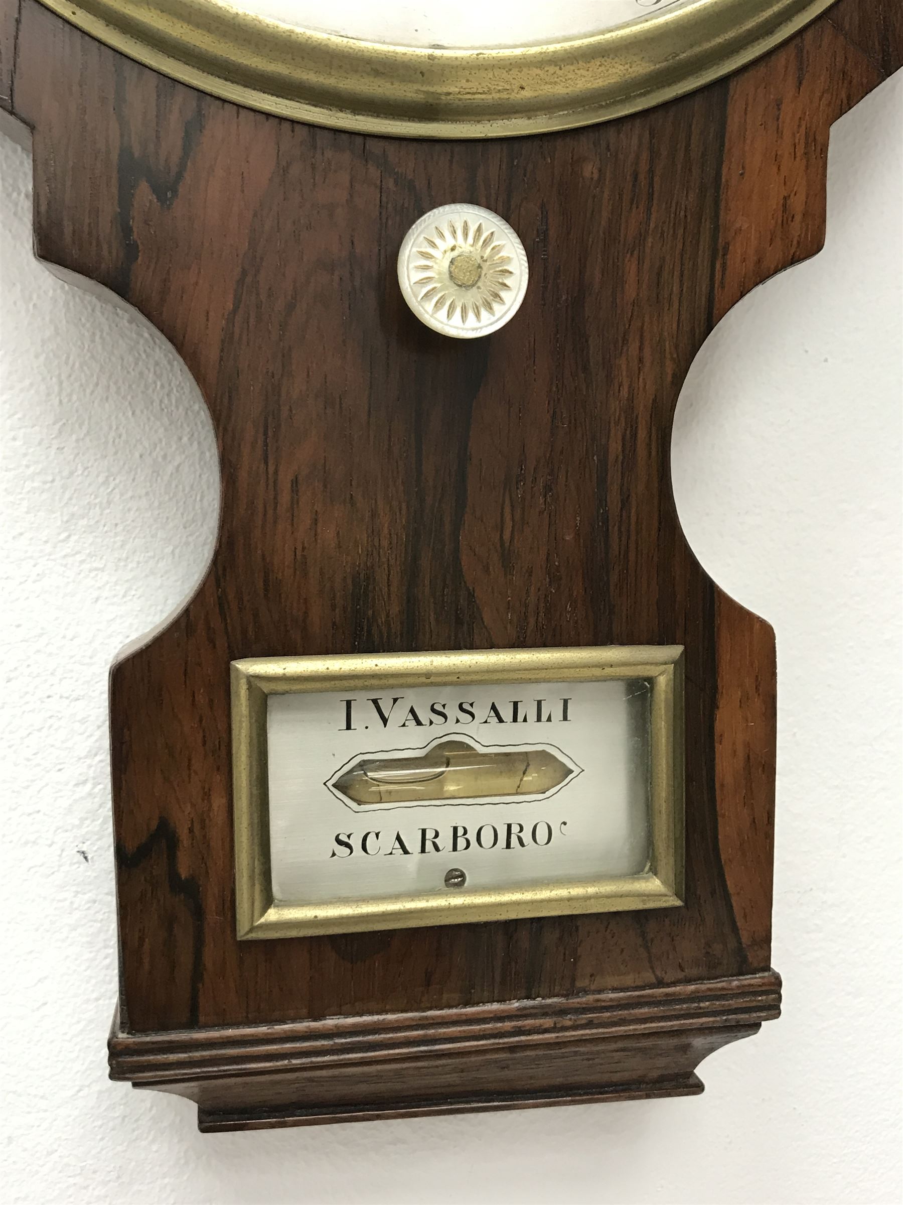 Early 19th century rosewood four dial banjo barometer, dry/damp dial, mercury thermometer, silvered circular register engraved with urn and scroll decoration, balance signed 'Vassalli Scarborough', fitted with mother of pearl adjusting handle