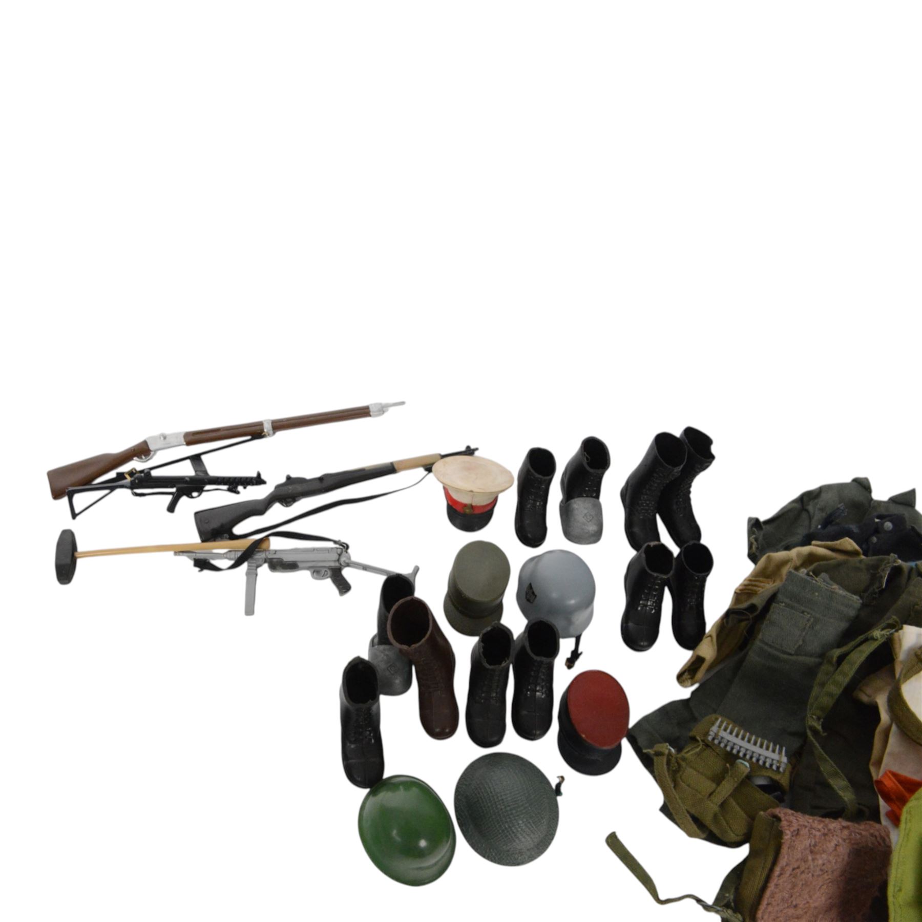 Two 1960s/70s Palitoy Action Man dolls, one with painted hair and one with flocked hair, both dressed in military uniform, together with a collection of mostly Palitoy/Hasbro Action Man clothing and accessories, including Special Operations Kit, Field Radio, weapons, shoes, helmets, clothing and other accessories