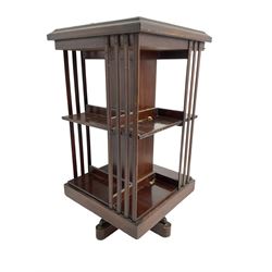 Edwardian inlaid mahogany revolving bookcase, moulded square top with satinwood band over three tiers with moulded uprights