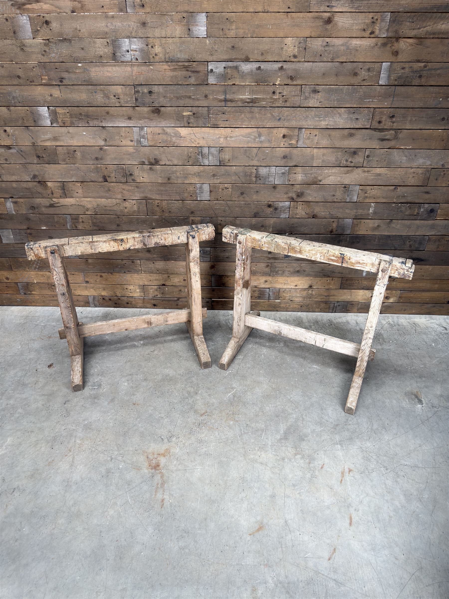 Pair of late 19th century pitch pine trestles, square tapering form in stripped finish