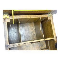 Edwardian oak metamorphic 'Britisher Writing Table', rectangular hinged top revealing correspondence compartments and hinged writing surface with underside storage, flanked by twin hinged compartments with dividers, on turned supports