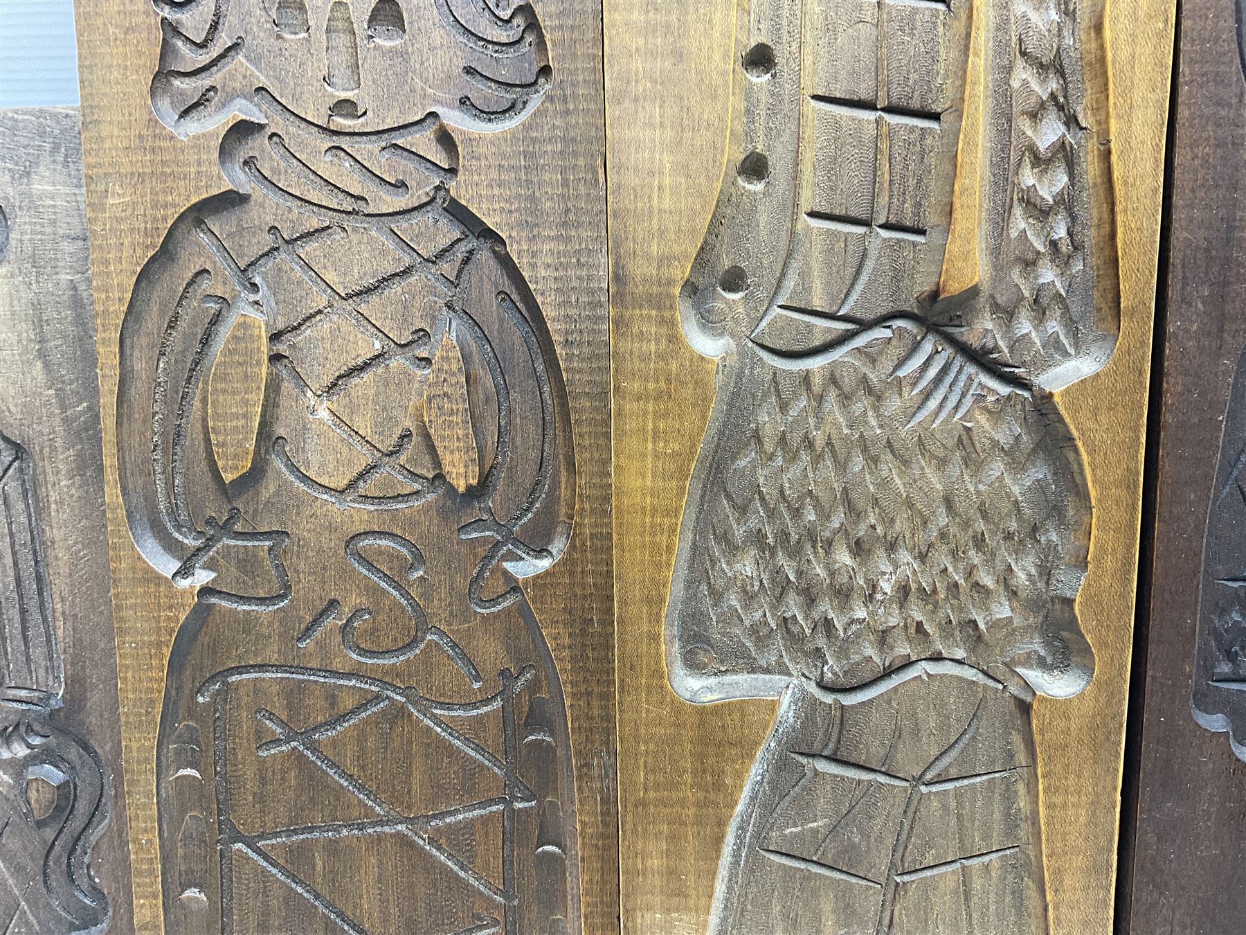 Six 20th century hardwood Dutch folk art Speculaasplank or biscuit moulds, typically carved with figures in traditional dress, largest H101cm