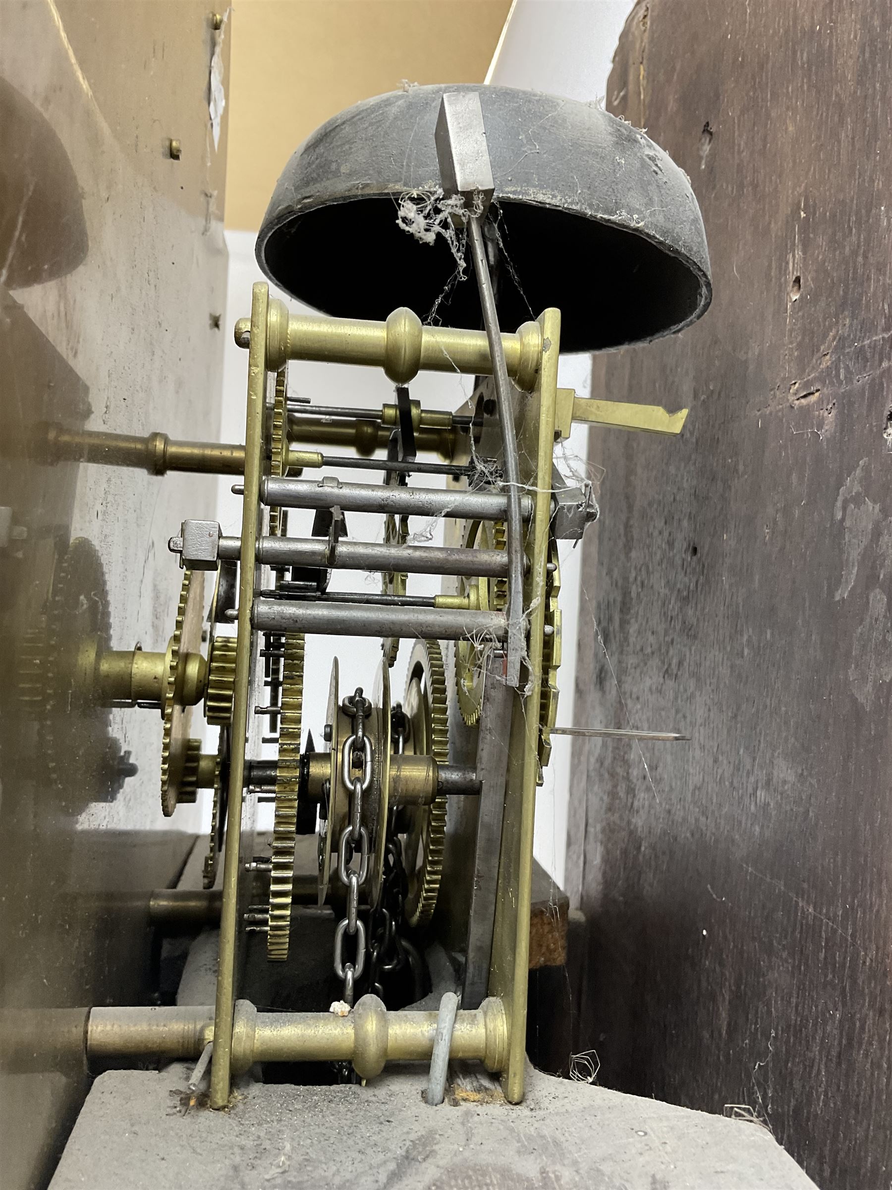 Victorian Jacobean revival oak cased 30 hour longcase clock - with a carved pediment and break arch door beneath, door with attached pilasters and gesso capitals, break arch trunk door with a carved grotesque, conforming carved plinth raised on ball feet, brass dial with spandrels, matted centre and chapter ring, dial pinned to a chain driven countwheel movement, striking the hours on a bell.
With weight and pendulum.