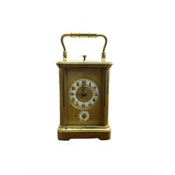French - small 8-day striking carriage clock with alarm and repeat functions, c1910, in a corniche case with a gilt dial mask alarm setting dial and enamel chapter, Arabic numerals and steel moon hands, rack striking movement, striking the hours, half-hours  and repeat on a coiled gong, with a silvered lever platform escapement.