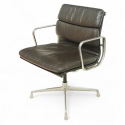 Charles and Ray Eames for Herman Miller - 1970s soft pad office chair model 'EA 207', low back and seat upholstered in chocolate brown leather flanked by open aluminium arms, raised on a non-swivelling aluminium base with manual screw adjustment function