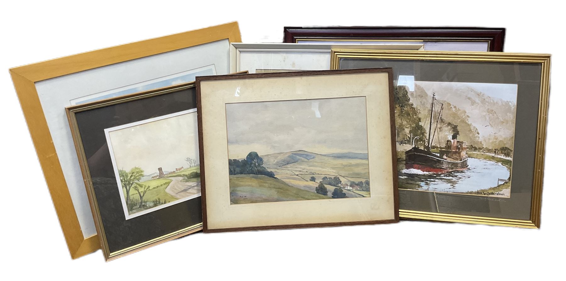 G A Townsend (British 20th century) 'The Trout Inn', watercolor signed and dated; M C W (British 20th century) The Wolds watercolor signed and dates, together with another watercolour and three landscape prints