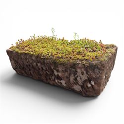 20th century rectangular sandstone trough planter, naturalistic rock form, planted with moss and succulents, weathered finish.