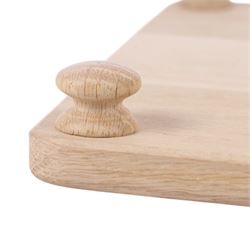 Wooden cheeseboard of rectangular form, upon four turned bun feet, H75cm W25cm