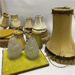 Upholster lamp/ vase stands with tassel detail, together with a selection of lampshades of various sizes 