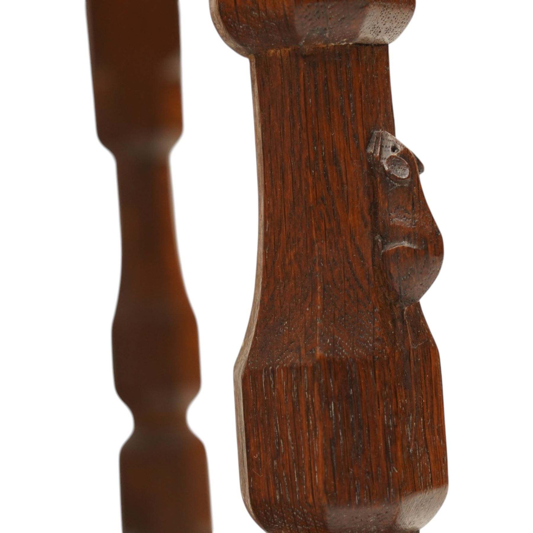 Mouseman - 1940's dark-honey oak rocking chair, high back with pierced double-lattice panel, over a beige-leather upholstered seat, shaped arm terminals above turned octagonal front-supports united by rocker base, with carved mouse signature, by the workshop of Robert Thompson of Kilburn