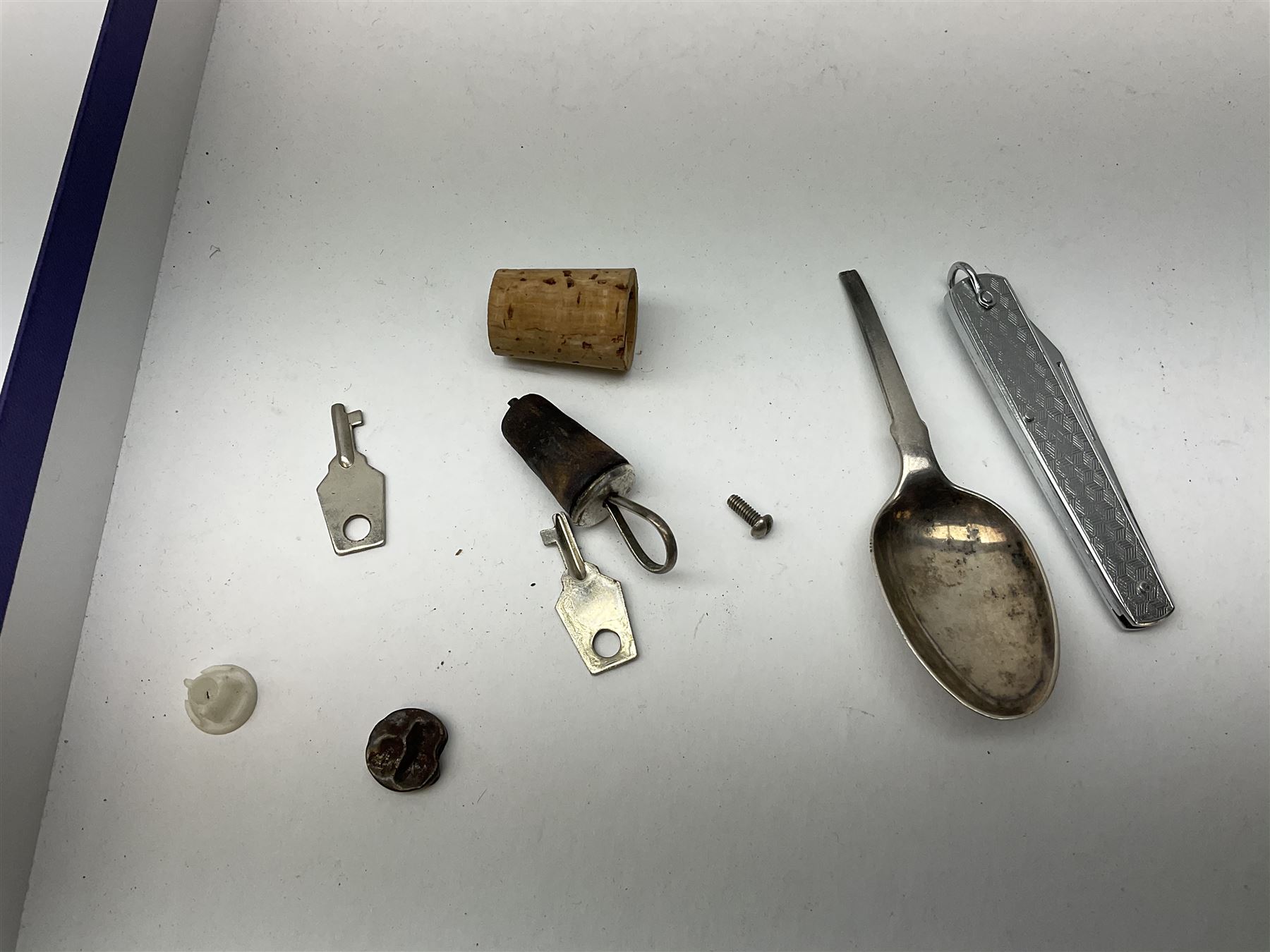 A group of assorted collectables, to include small oval purple guilloche enamel frame, WWII matchbox holder depicting Winston Churchill, Halcyon Days enamel box, Ronson table lighter, ebonised glove stretchers, ivory napkin ring, mother of pearl handled button hook, engine turned cigarette case, etc. 