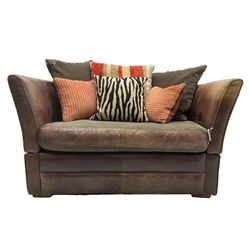 Knole design two-seat snuggler sofa, upholstered in brown leather with scatter cushions upholstered in contrasting striped and zebra print fabric