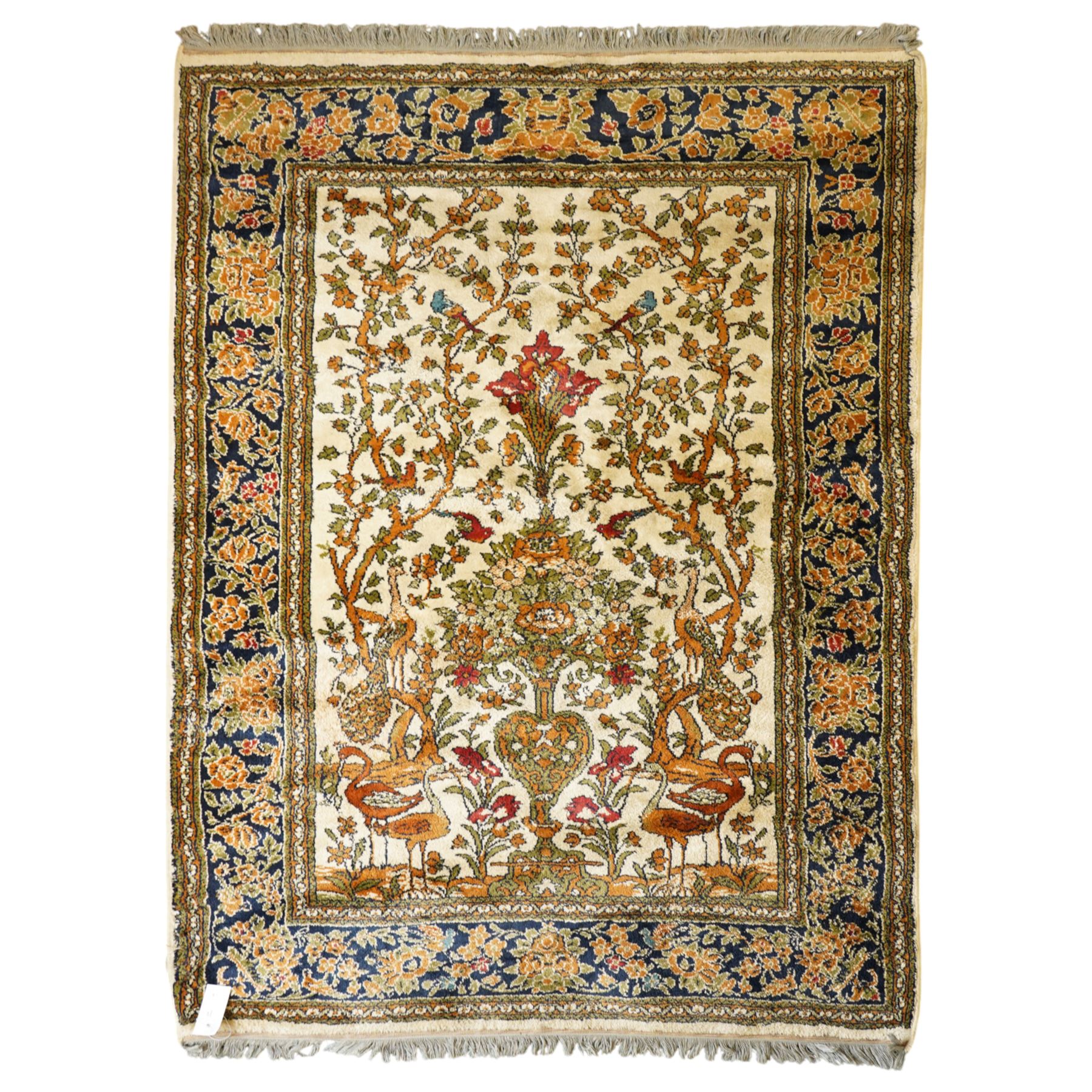 Kashan style rug, twin peacocks flanking a large decorative urn, motifs tree of life style, multiple borders with fine floral patterns 