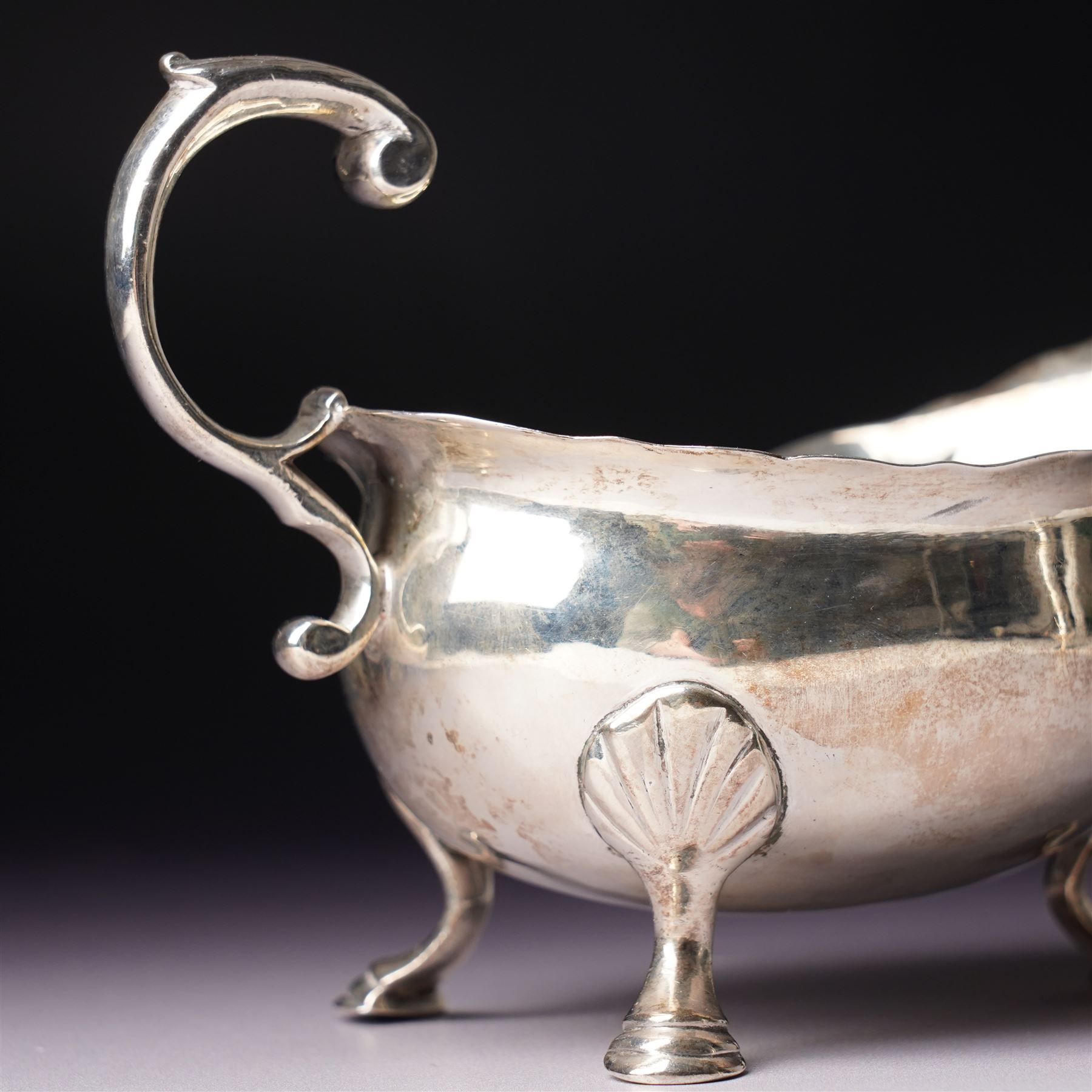 Silver vase shape sugar caster H15cm London 1975 Maker C J Vander Ltd and a George III silver sauce boat with crimped rim and 'C' scroll handle London 1763 Maker possibly William Skeen