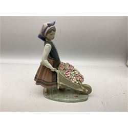 Lladro figure Barrow Of Blossoms, modelled as a girl pushing a wheelbarrow of flowers, no. 1419, with original box, H26cm