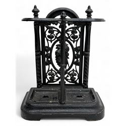 19th century cast iron umbrella and stick stand, the pierced gothic backplate with foliate...