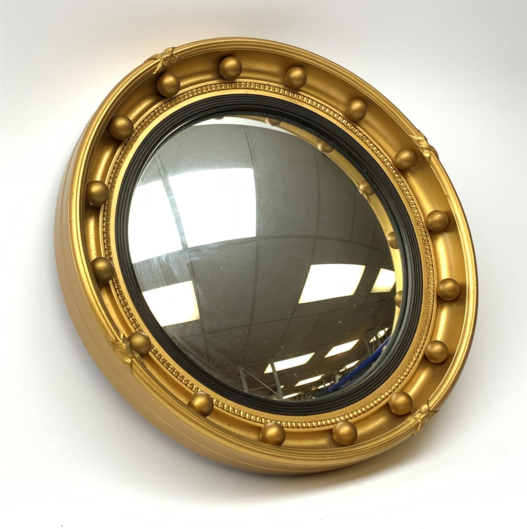 A vintage Atsonea convex mirror, of circular form with gilt frame, D41.5cm. 
