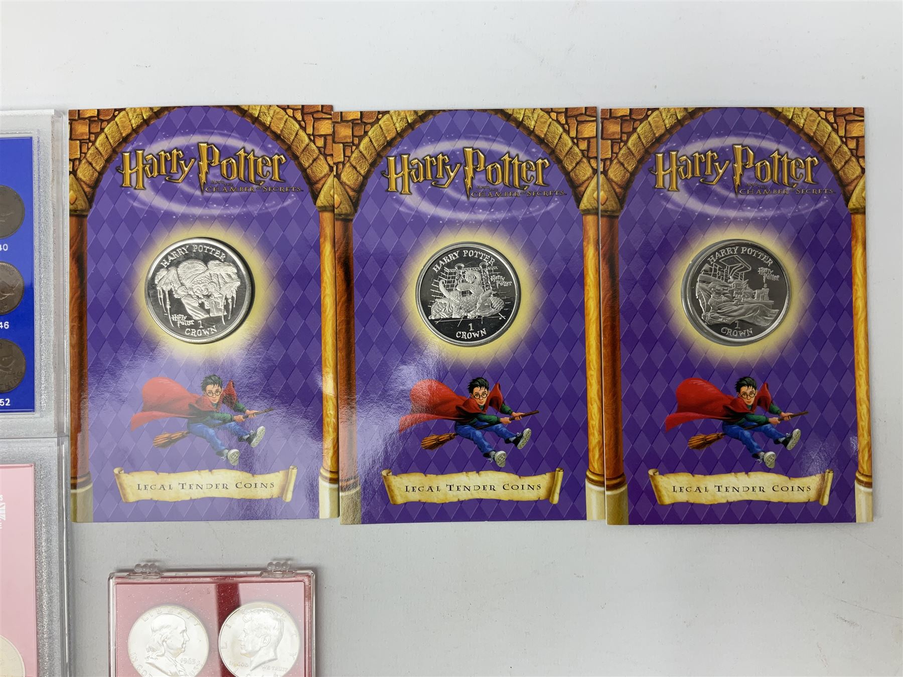 Coins including coinage of Great Britain 1970 proof set, United Kingdom 1997 brilliant uncirculated coin collection, various unofficial sets in plastic displays, three Isle of Man commemorative Harry Potter crown coins, United States of America 1982 silver half dollar, pre-decimal and other Great British and World coins etc 
