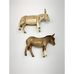 A group of Beswick figures, comprising two Charlie Wall Queen pigs, and a Charlie Wall Boy pig, two donkeys, sheep, and a lamb. 