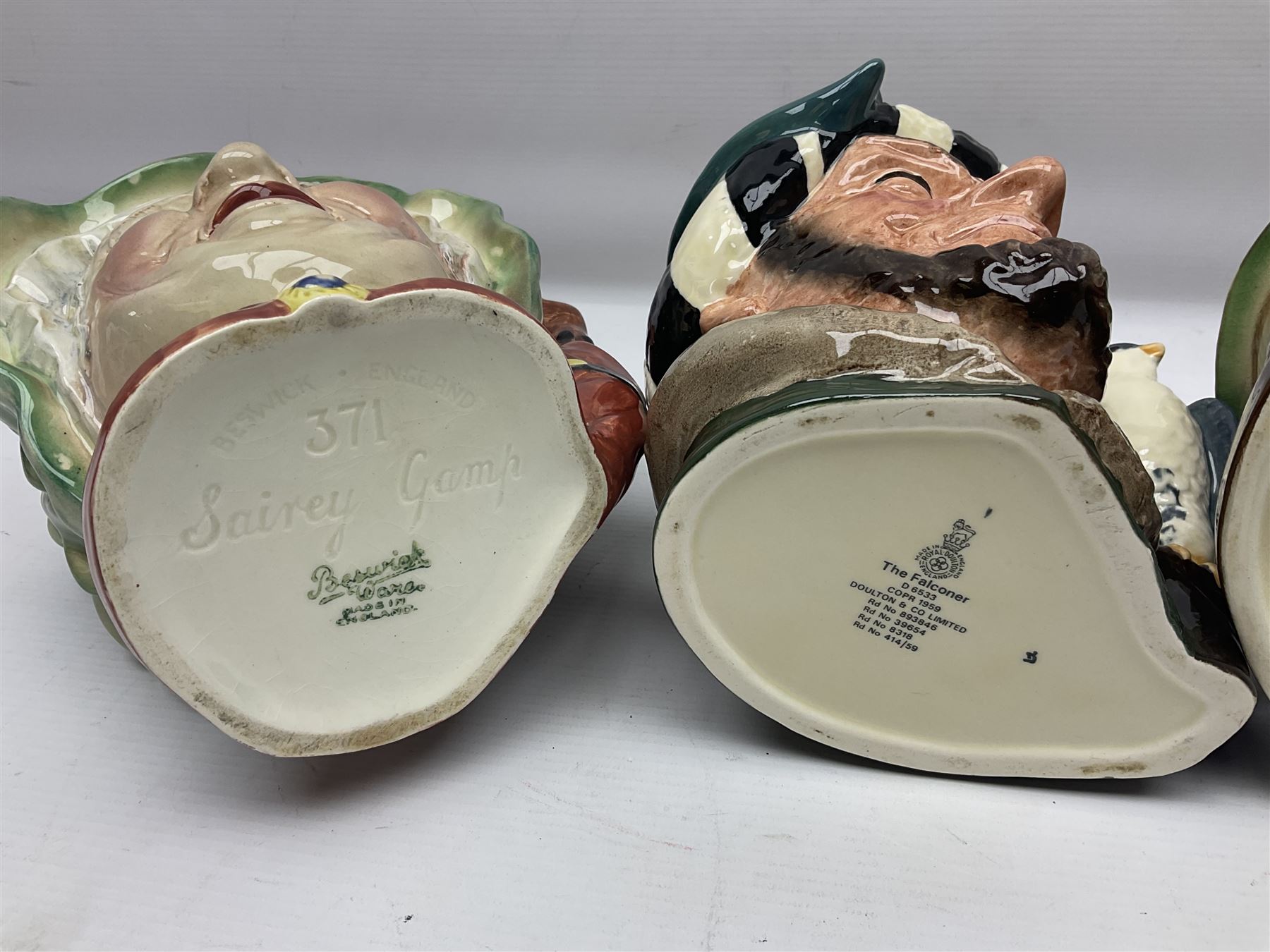 Collection of Royal Doulton and Beswick character jugs of various sizes, including North American Indian D6611, The Falconer D6533,  Tony Weller 281, Sairey Gamp 371 etc
